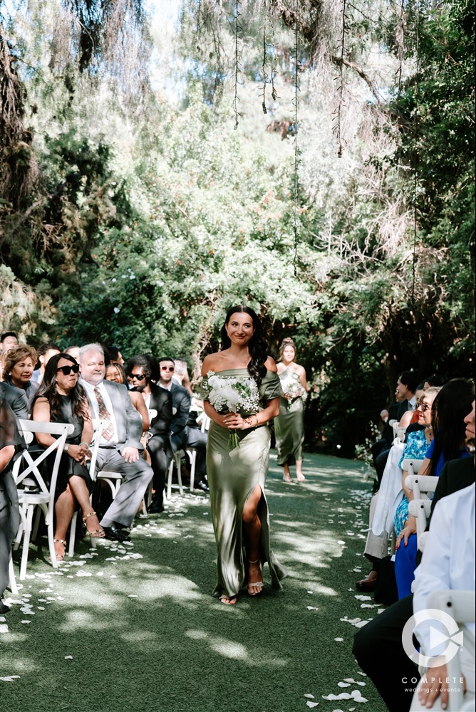 bridesmaid walking down the aisle