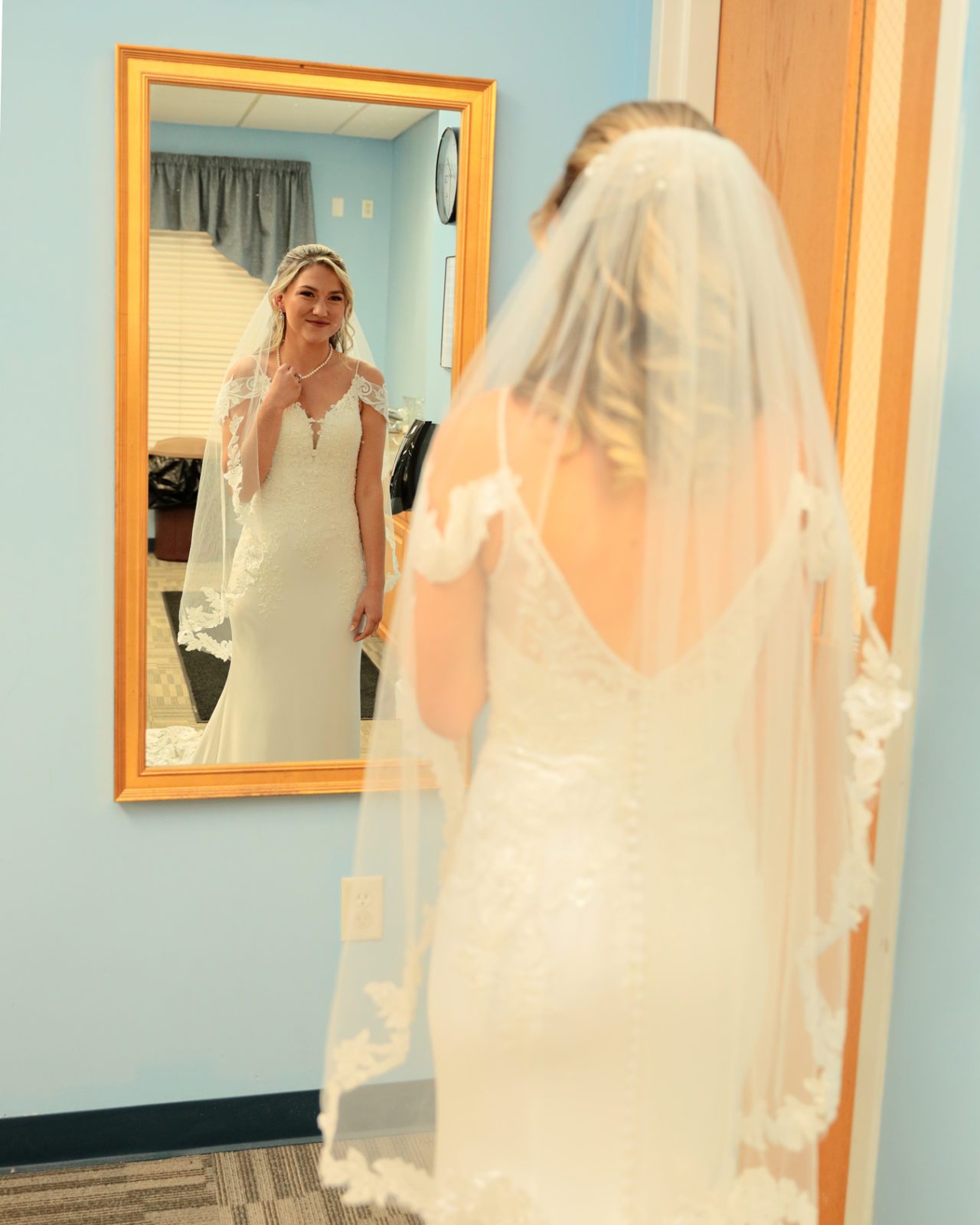 Bride Looks in Mirror