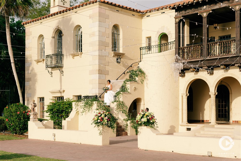 Bride Descends Stairs at Powel Crosley Estate