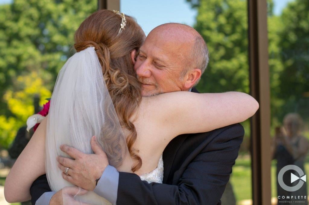 Father hugs daughter after the Man at Wedding giving the PERFECT Father of the Bride Speech