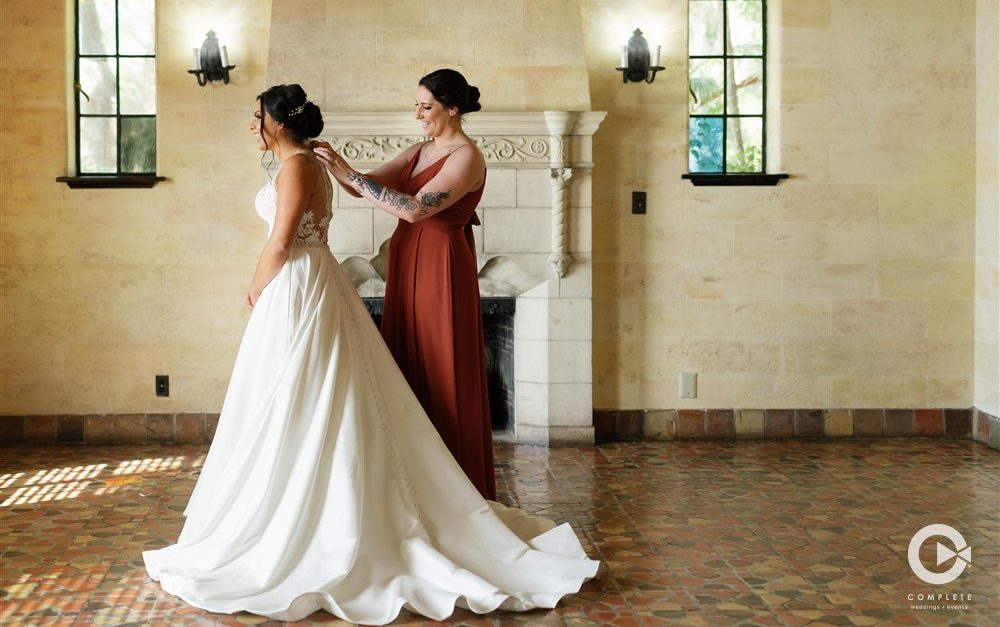 bride and bridesmaid in terra-cotta dress
