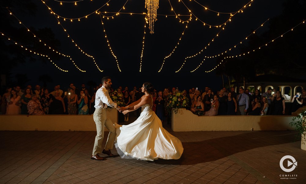 bride and groom first dance at night