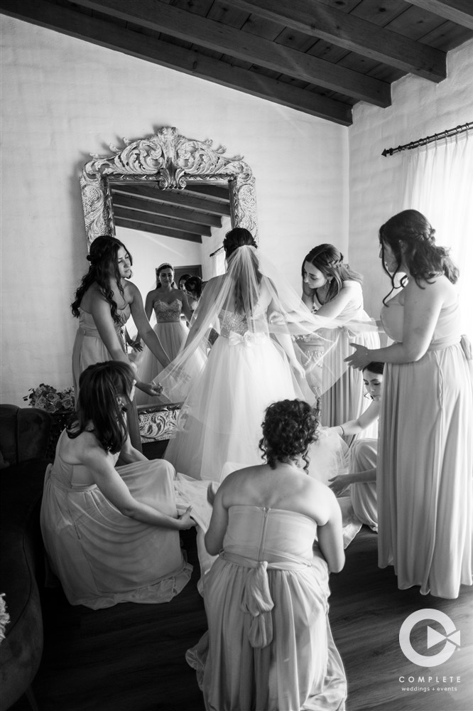 bridesmaids help bride getting ready