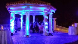 Romantic Blue Wedding Lighting of a roman-style pergola