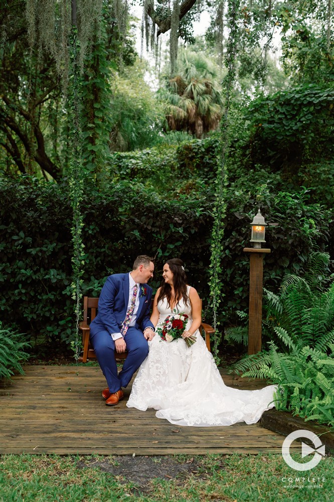 Newlywed Bride and Groom at the edge of the woods at Bakers ranch wedding venue near Sarasota