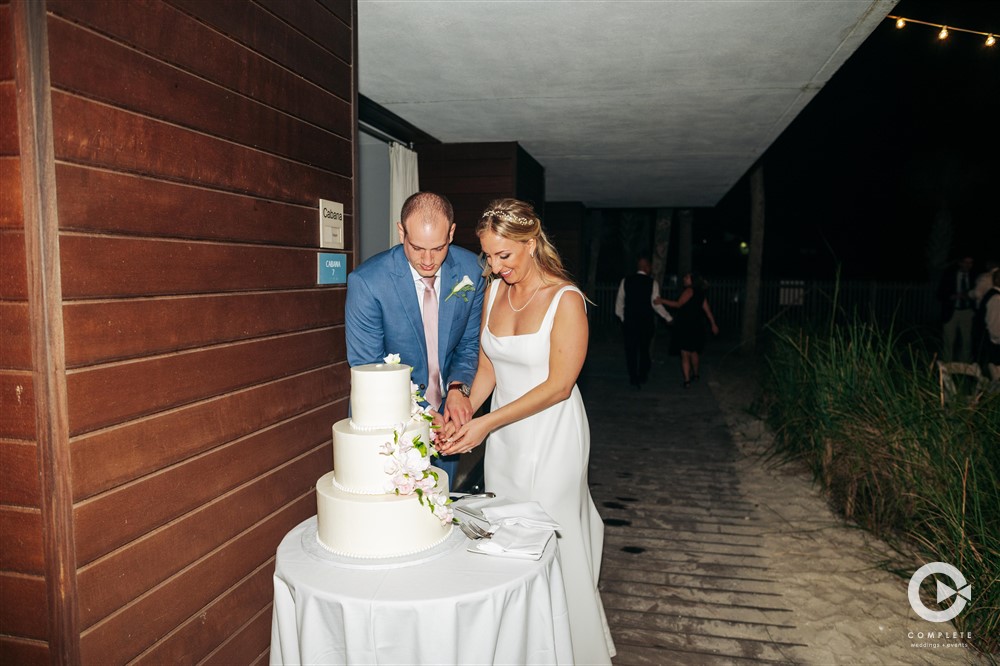 Bride and Groom cut the cake