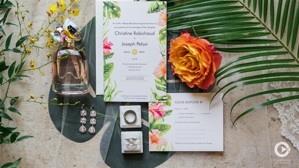 Detail shot of invitations at Christine and Joe's Captivating Tropical Wedding at Palmetto Riverside Bed and Breakfast