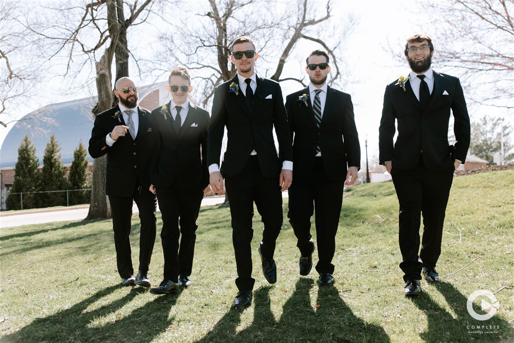 Guys dressed in suits at a bachelor party in Sarasota