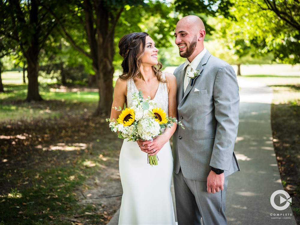 couple with sunflower bouquet