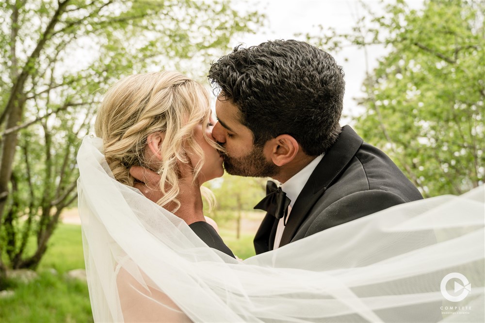 bride and groom kiss