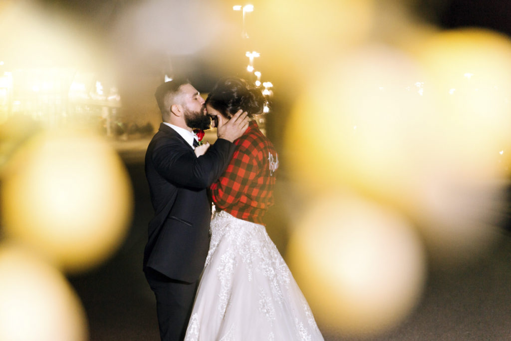 Creative Wedding Picture with Twinkle Lights in Foreground