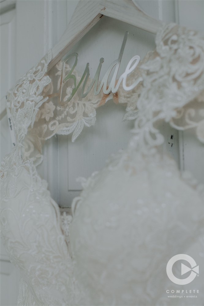 Lace Wedding Dress hanging on custom hanger