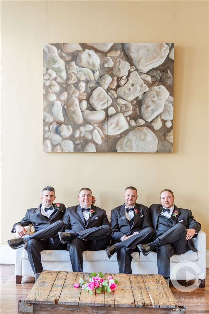 groomsmen sitting on couch at veridian