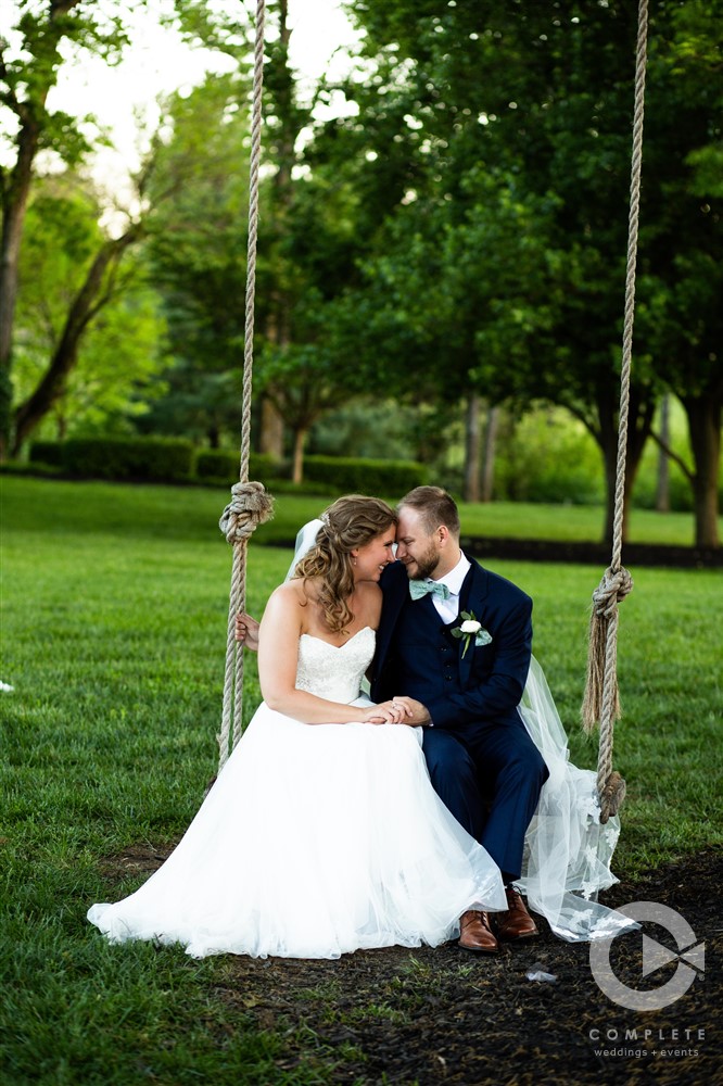 Bride and groom swinging and talking