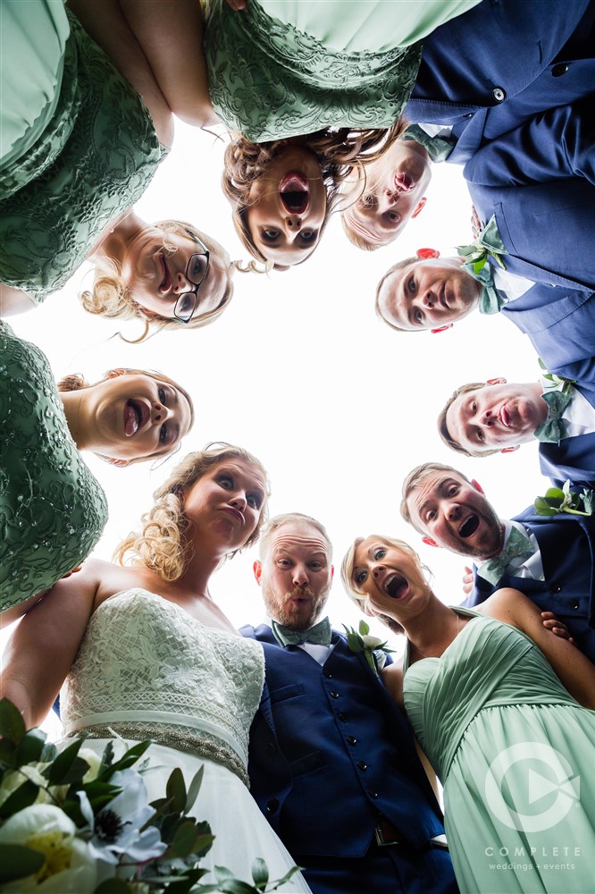 Goofy circle wedding picture of bridal party