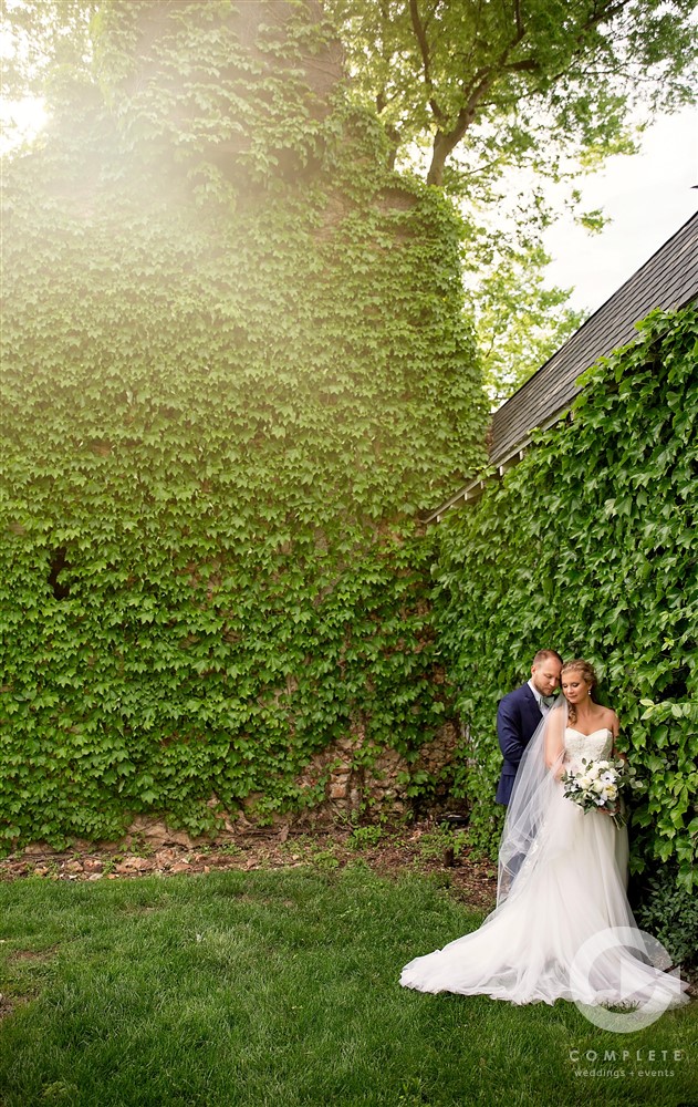 golden hour wedding portrait by ivy wall at Historic Haseltine Estate