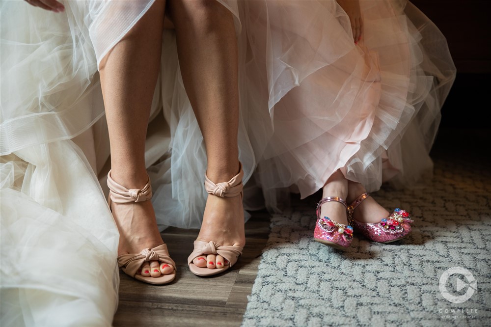 detail shot of bride and flower girls shoes