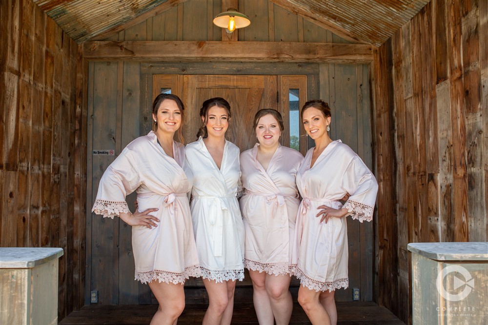 bridal party wearing robes before preparing for ceremony