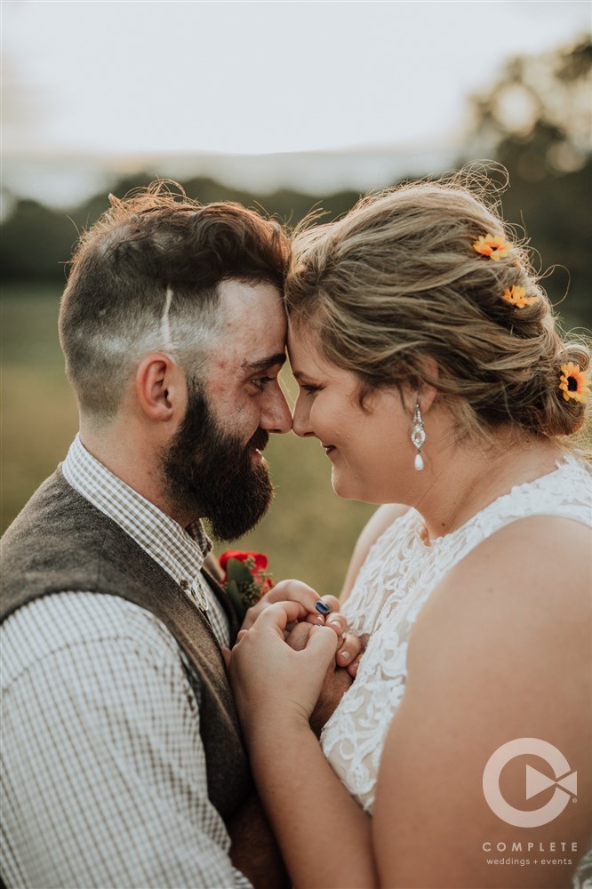 bride and groom loving head bump