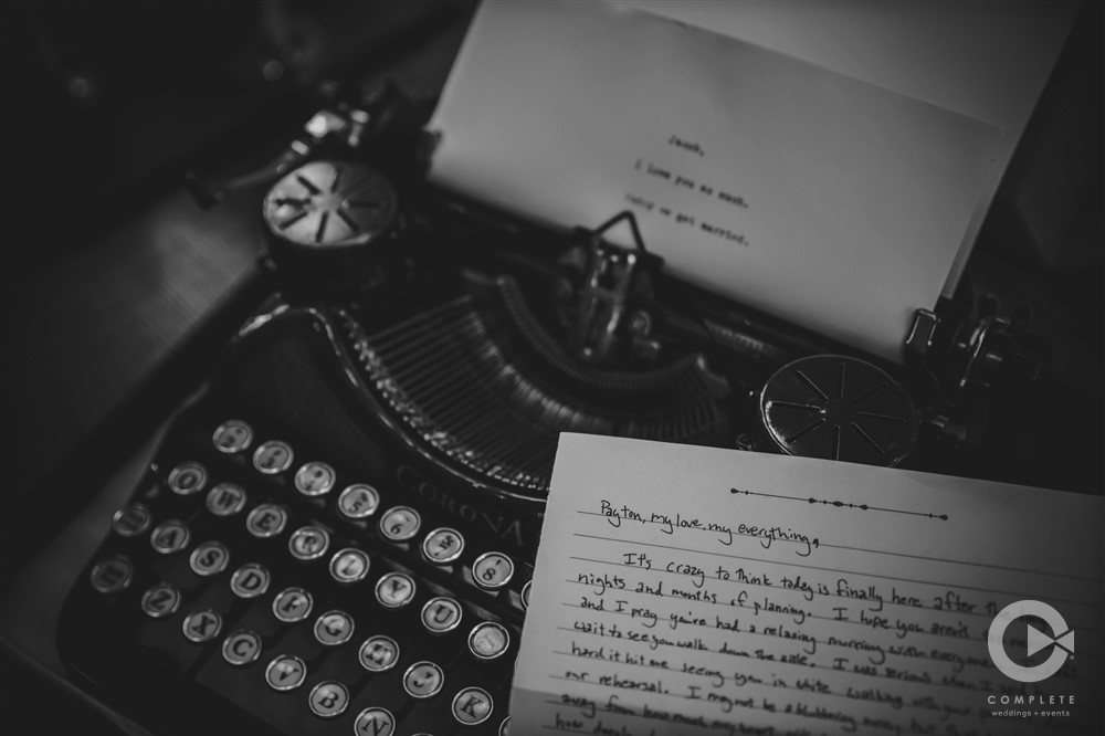 groom's letter to bride on top of retro typewriter
