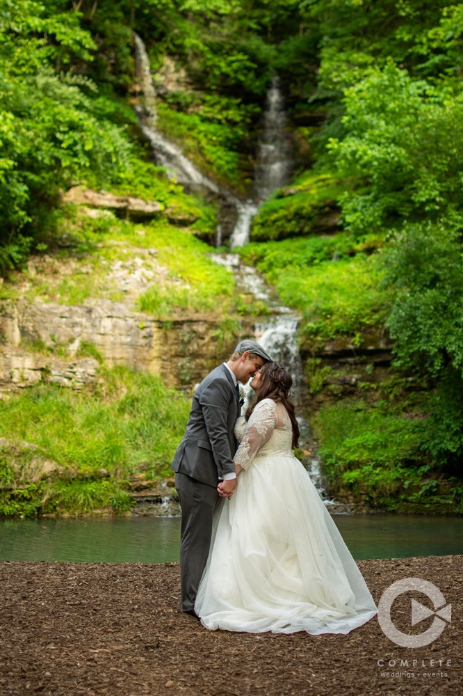 Dogwood Canyon wedding venue couple portrait in front of waterfall