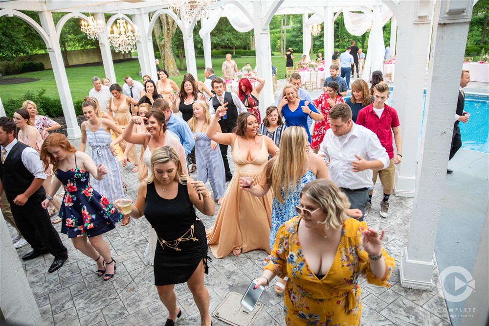 guests do a line dance during reception