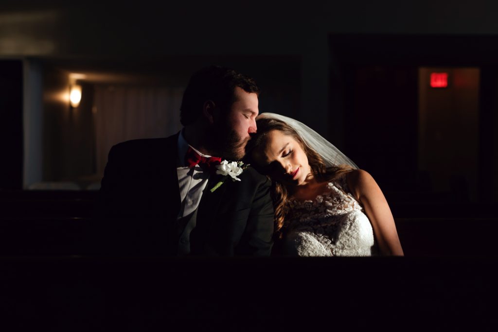 bride and groom relax in the dark