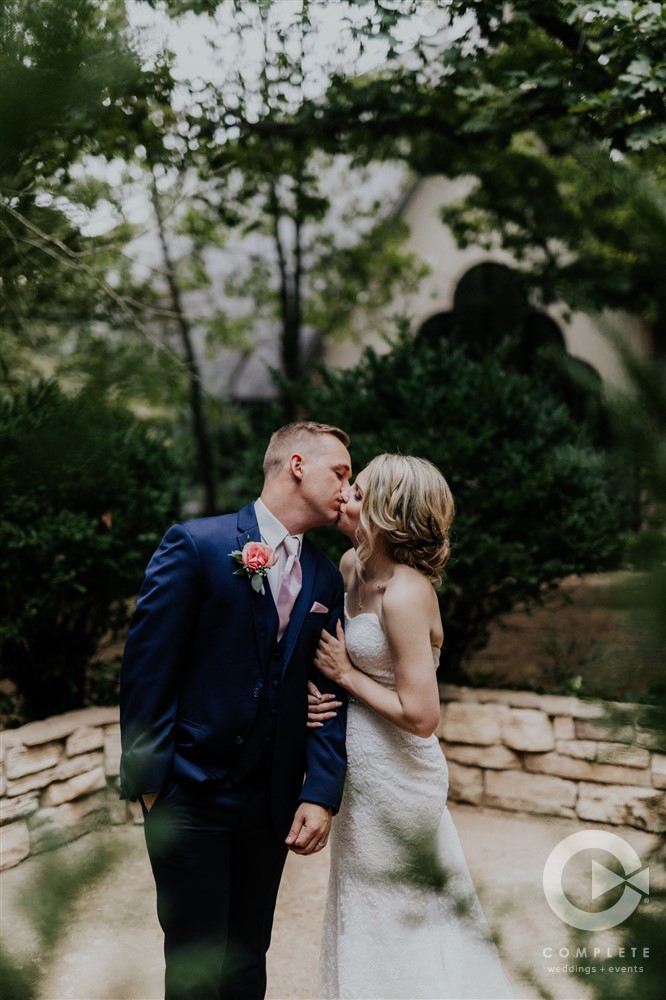 wedding day kiss in a garden
