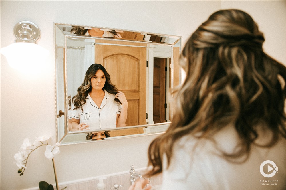 bride getting ready in bathroom