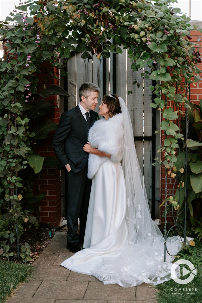 bride and groom looking into each others eyes in courtyard at Savoy Ballroom