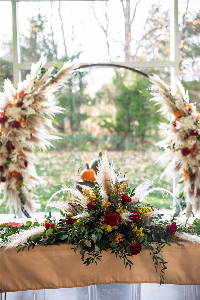 Greenhouse wedding fall decorations with pompas grass