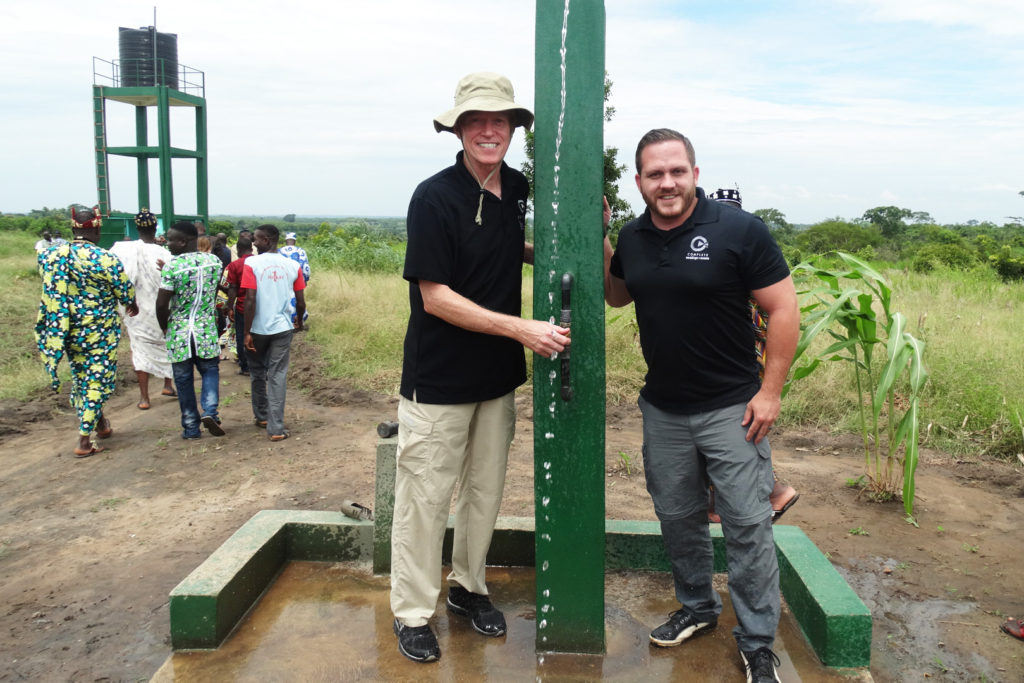 Dan and Don at the well Complete Weddings + Events built for people in Africa