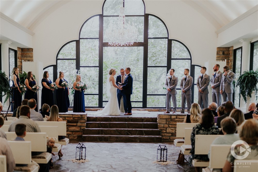 bridal party at ceremony at stonegate glass chapel