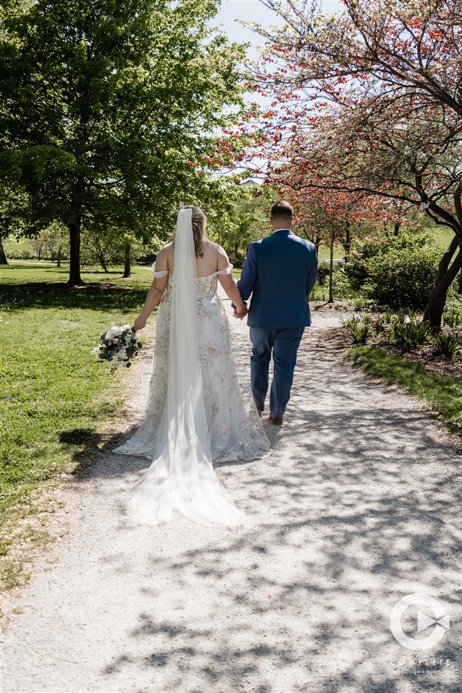 Complete Weddings + Events Photography, bride and groom walking