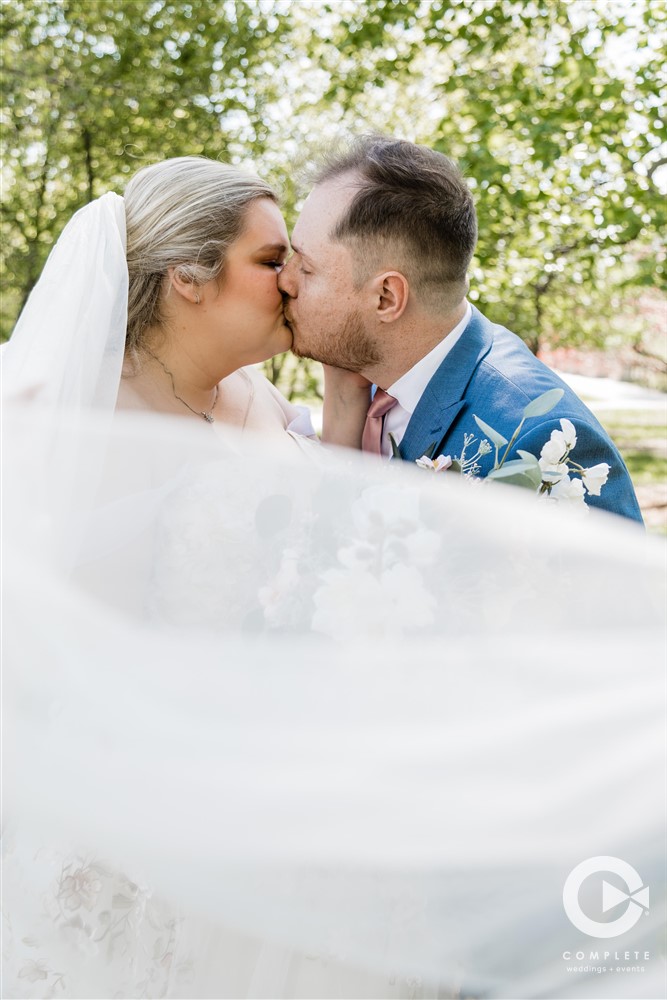 Complete Weddings + Events Photography, bride and groom kissing