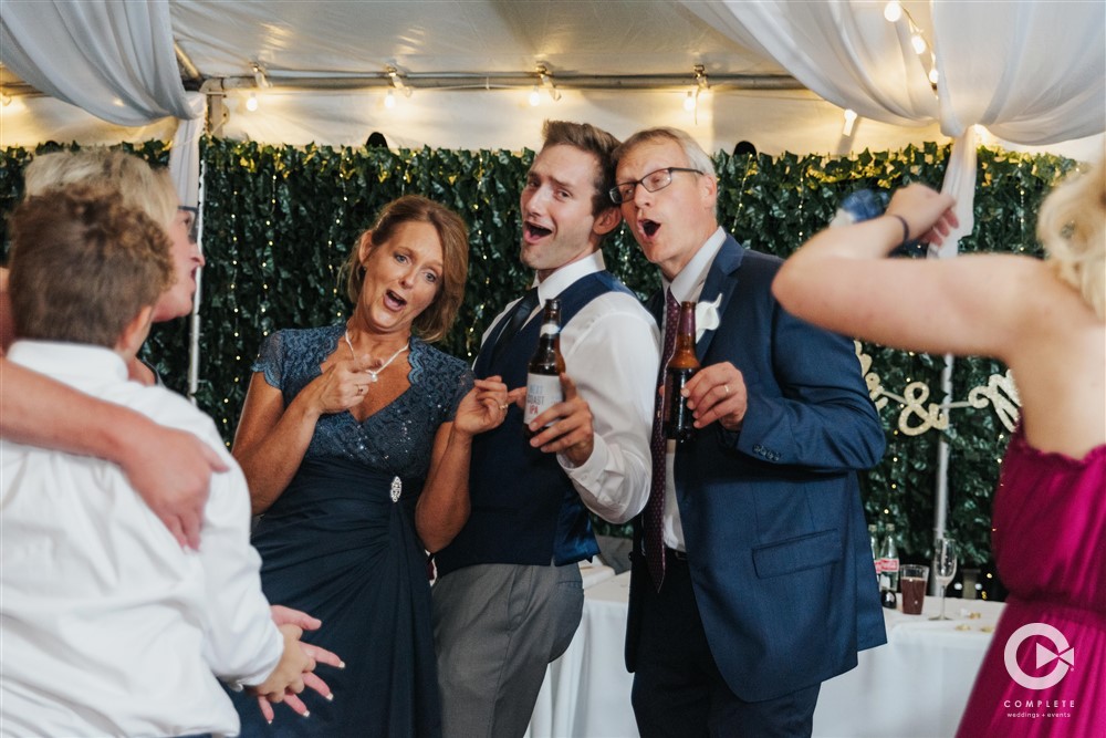 Group singing along at a St. Louis Outdoor wedding reception