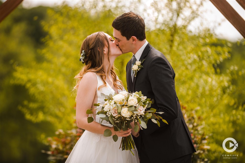 bride, groom, complete weddings + events photography, wedding photographer, bride and groom kissing