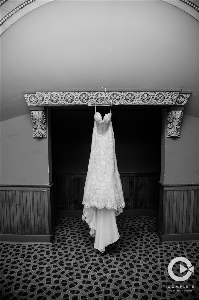 Wedding dress hanging in fireplace