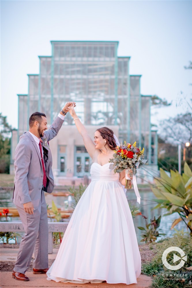 Bride and groom outside their wedding venue taking a moment together