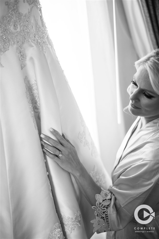 Bride Admiring Wedding Dress