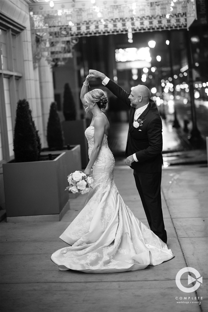 Groom Twirling Bride Eve + Jarrod's Downtown Marriott Wedding