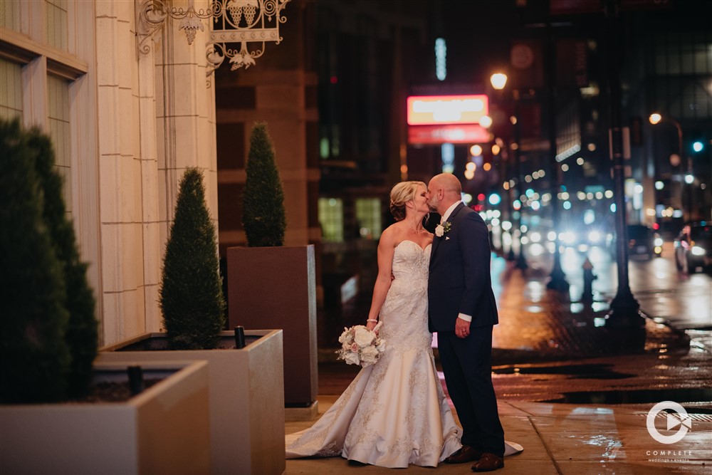 Eve + Jarrod's Downtown Marriott Wedding Bride & Groom kissing Downtown wedding in STL