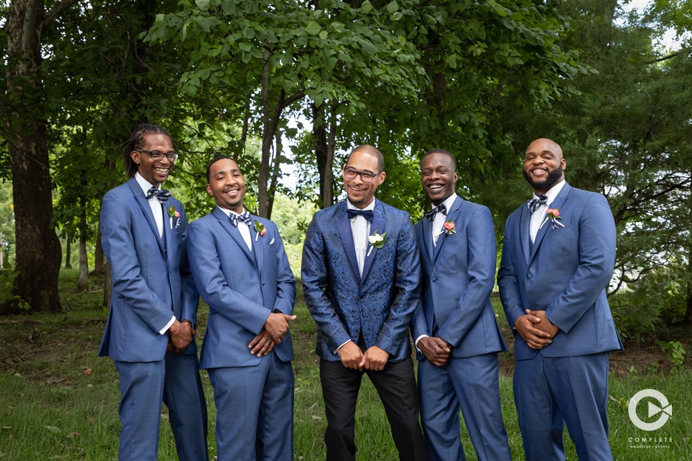 groomsmen and groom In blue wedding colors