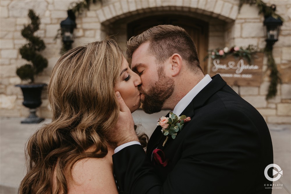 Complete Weddings + Events Photography, bride and groom wedding portraits, bride and groom kissing