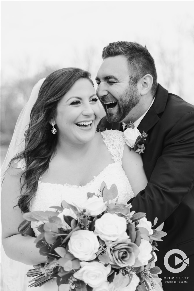 brid and groom laughing