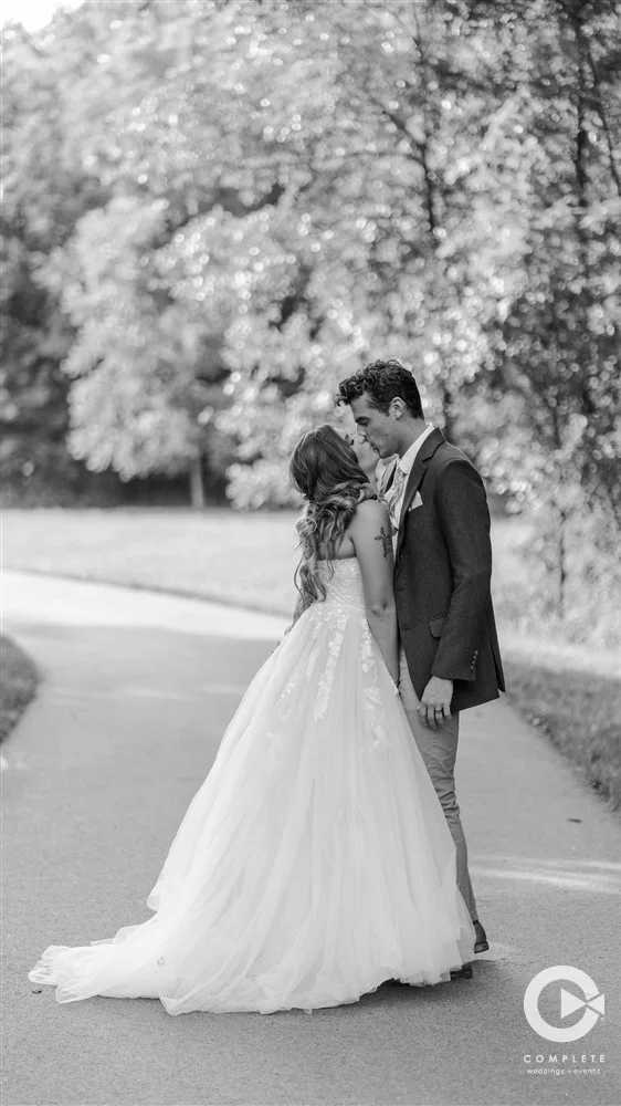 bride and groom kissing, complete weddings and events photography