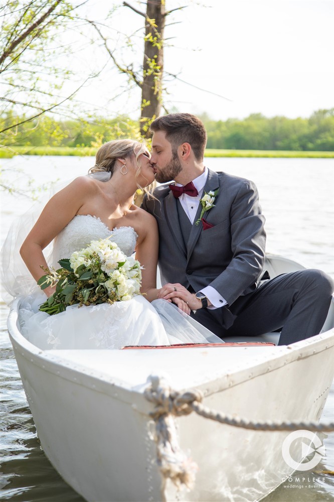 romantic boat picture of bride and groom