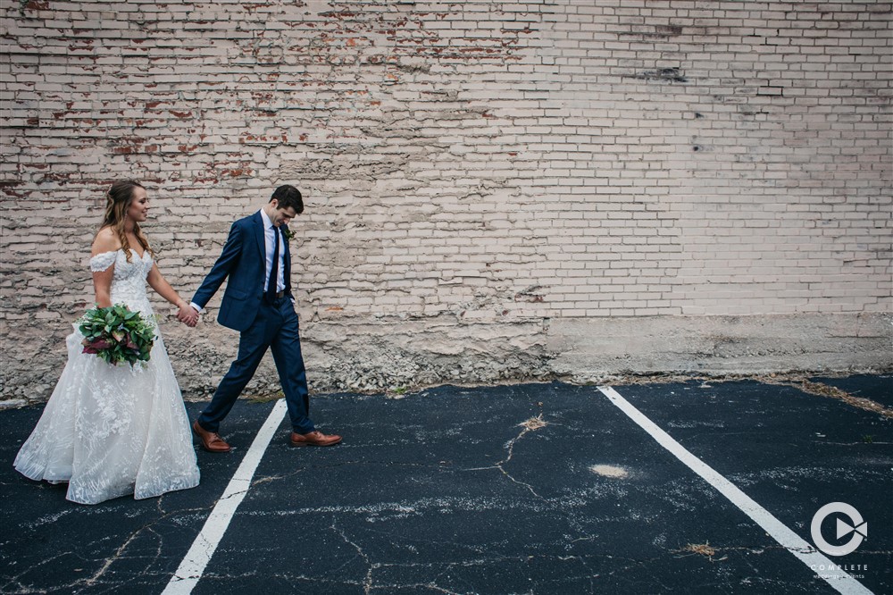 bride and groom walking, complete weddings + events photography, St. Louis wedding