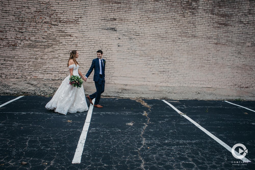 bride and groom walking, complete weddings + events photography, St. Louis wedding, dayton thompson