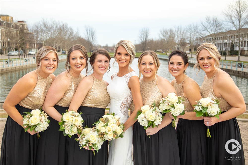 bridesmaids in black and gold